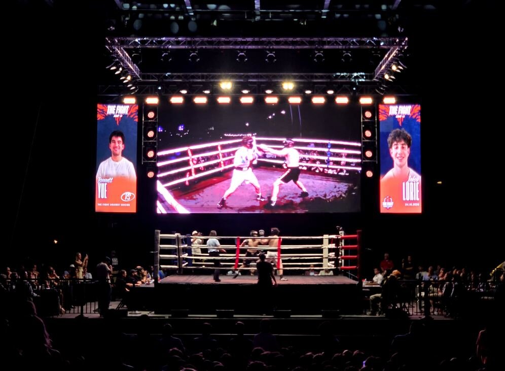 Stage lighting and LED video walls for The Fight charity boxing event